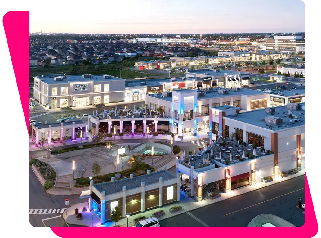 Aerial view of a Brossard retail district at sunset