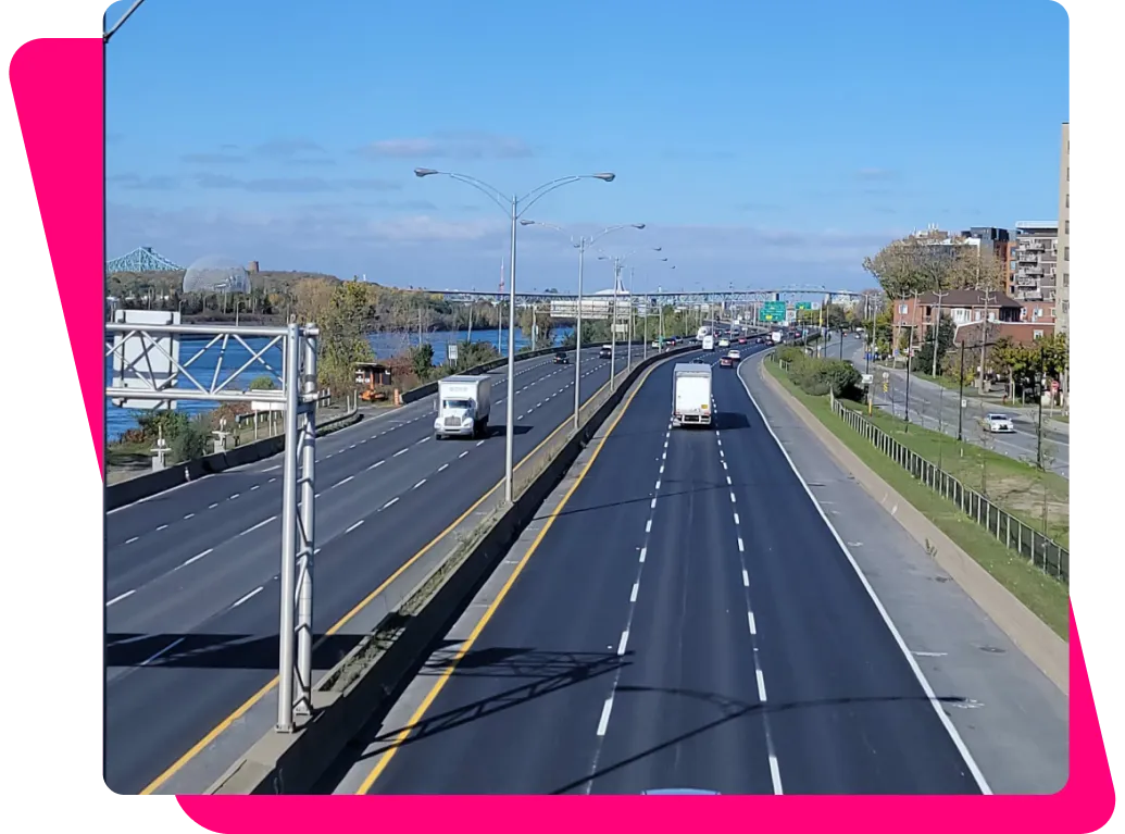 Highway bordering Saint-Lambert, with trucks in traffic